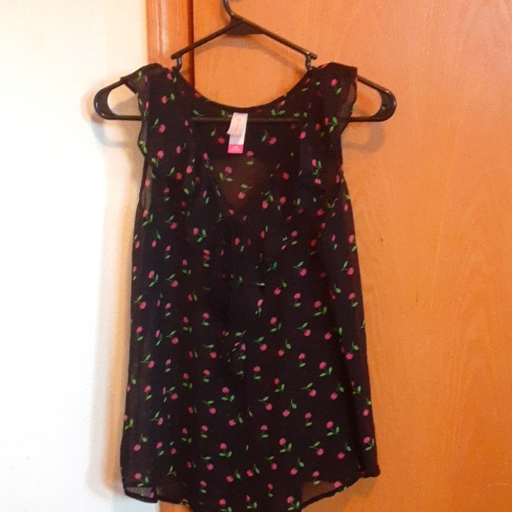 Sleeveless, pullover, sheer Top.